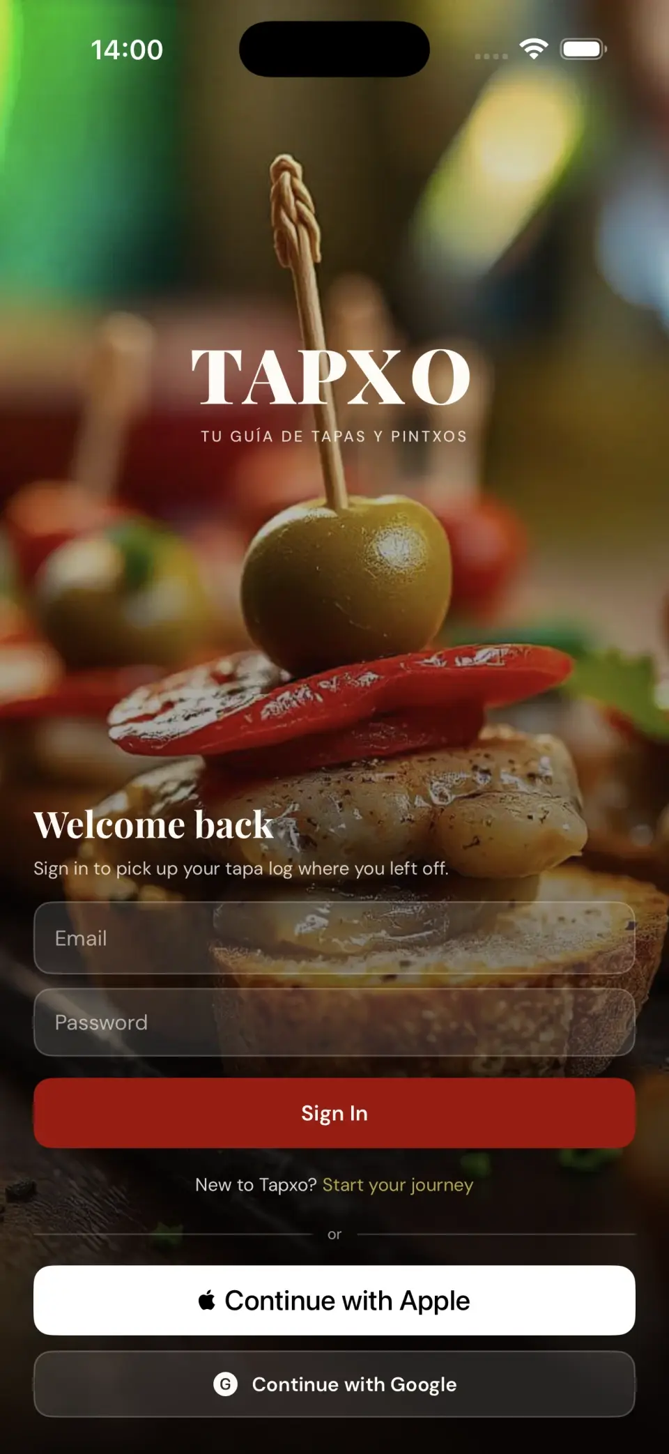 Tapxo sign-in screen over a photo of tapas and pintxos